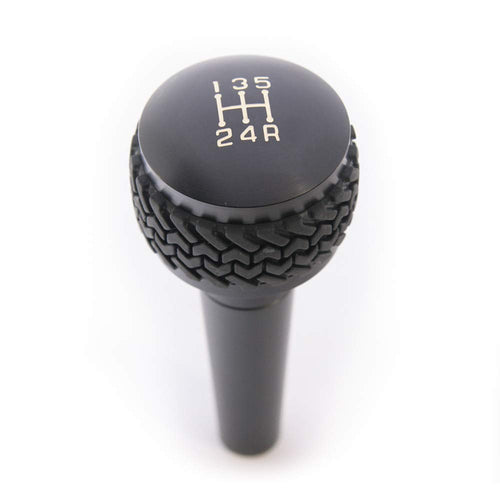 Manual Shift Knob for Wrangler TJ 1997-2006 | DV8 Offroad | 5-Speed Transmission | Billet Aluminum Construction | Rubber Tire Tread Grip | Anodized Finish | D-JP-180022-BK