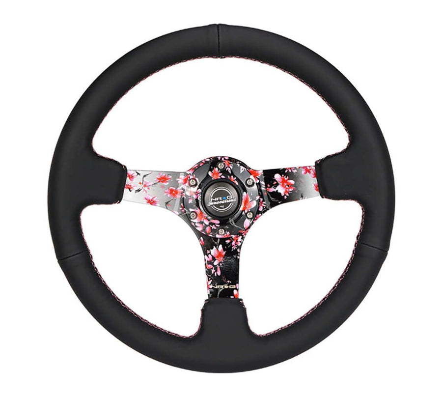 NRG Innovations Reinforced NRG-RST-036SAK-R Steering Wheel, Hydro Dipped Sakura Floral 3" Deep, 5mm Spoke, 350mm, Pink Suede with Black Baseball Stitching