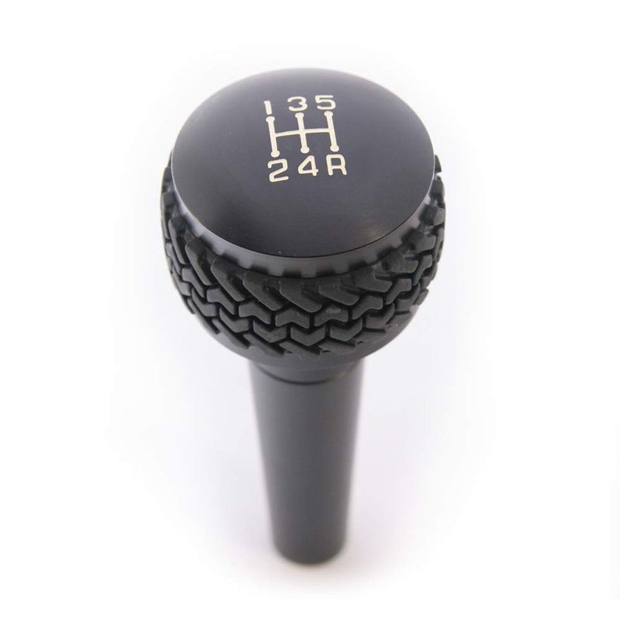 Manual Shift Knob for Wrangler TJ 1997-2006 | DV8 Offroad | 5-Speed Transmission | Billet Aluminum Construction | Rubber Tire Tread Grip | Anodized Finish | D-JP-180022-BK