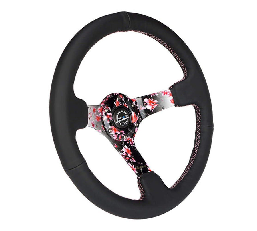 NRG Innovations Reinforced NRG-RST-036SAK-R Steering Wheel, Hydro Dipped Sakura Floral 3" Deep, 5mm Spoke, 350mm, Pink Suede with Black Baseball Stitching