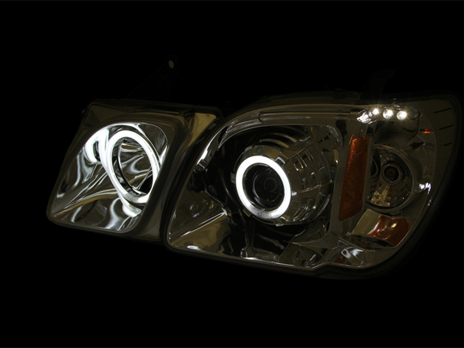 Black Clear/Amber AnzoUSA 111170 Projector Halo Headlight for Lexus LX470 - (Sold in Pairs)