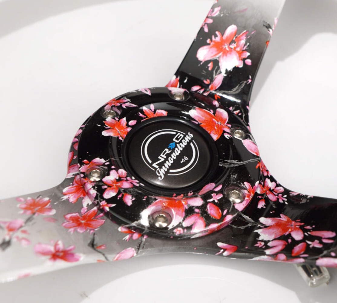 NRG Innovations Reinforced NRG-RST-036SAK-R Steering Wheel, Hydro Dipped Sakura Floral 3" Deep, 5mm Spoke, 350mm, Pink Suede with Black Baseball Stitching