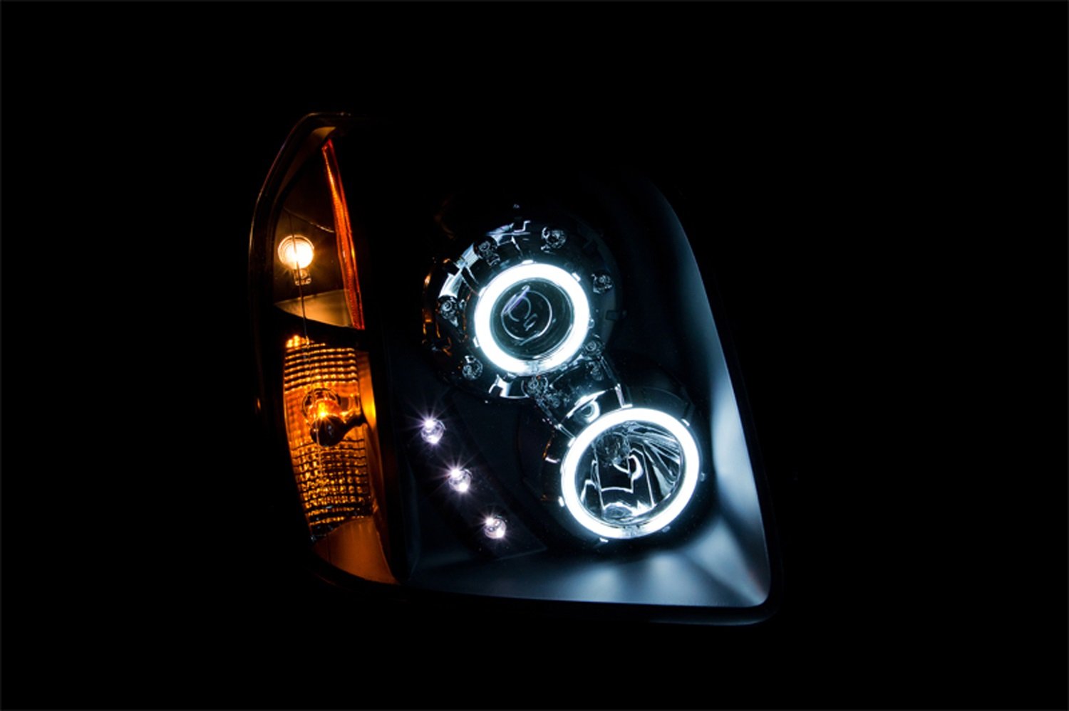 GMC Yukon Anzo USA 111148 Projector Halo Black Clear Amber Headlight Assembly - (Sold in Pairs)