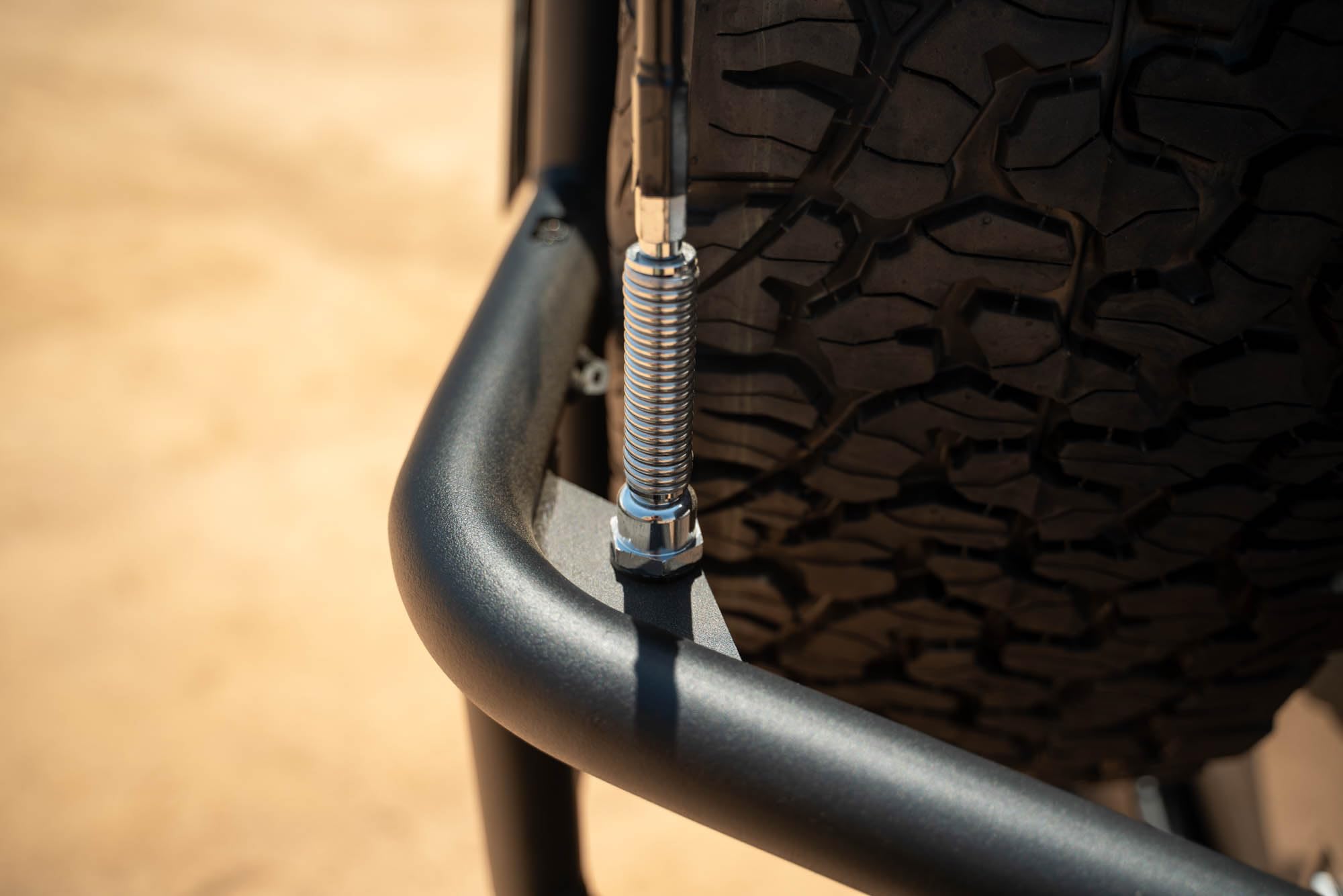 Tire Carrier Body Mounted for 2007-2018 Jeep Wrangler JK | Improves Departure Angle | Transfers Weight from The Door Hinges to The Vehicle Body | LED License Plate Light | 2 Whip Flag/Antenna Mounts