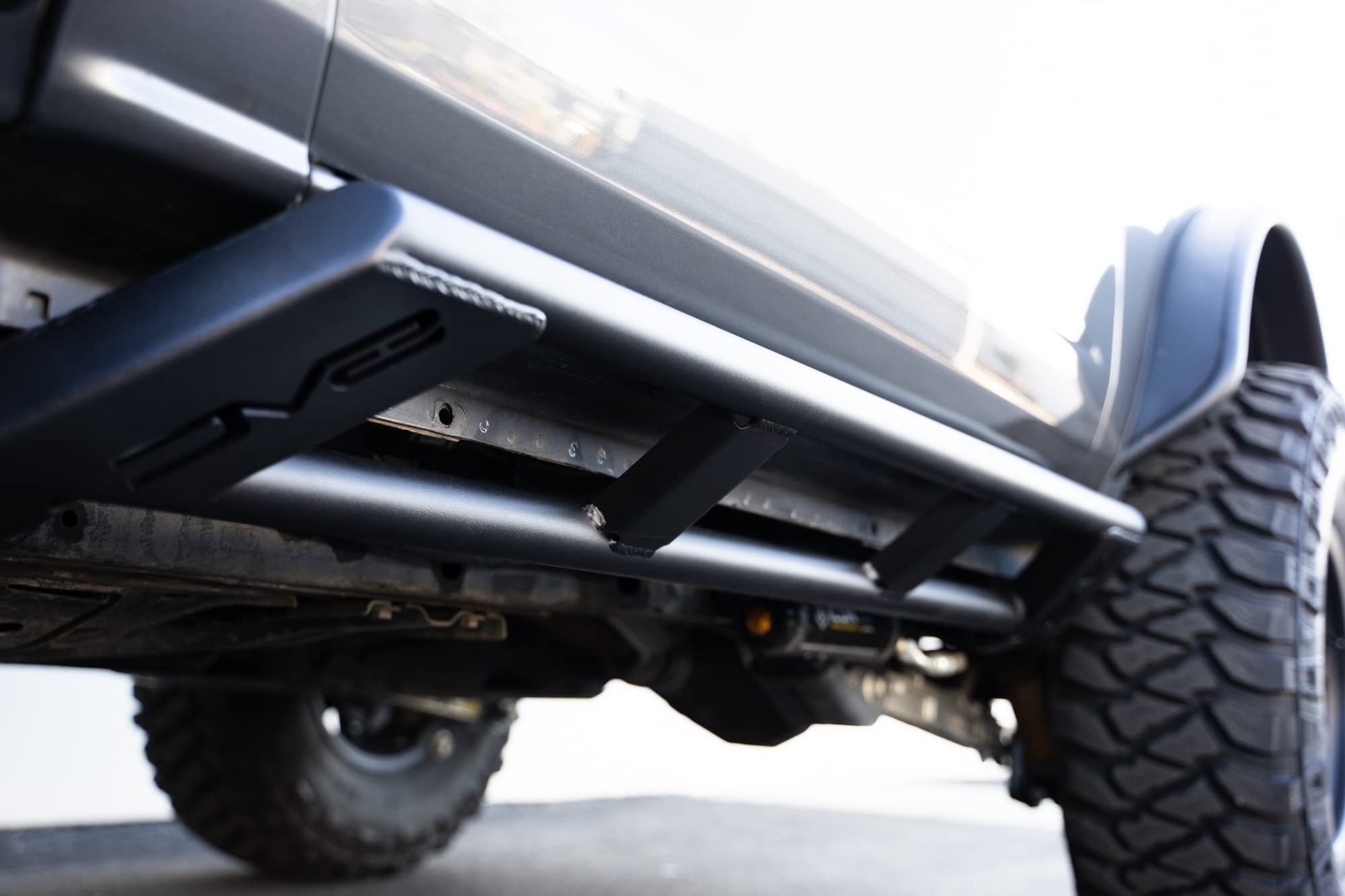 FS-15 Series DV8 Offroad 2-Door Rock Sliders 2021-2025 Ford Bronco | True Frame Mounted Rock Slider | Durable Tube Style Design | Full Coverage from Wheel Well to Wheel Well