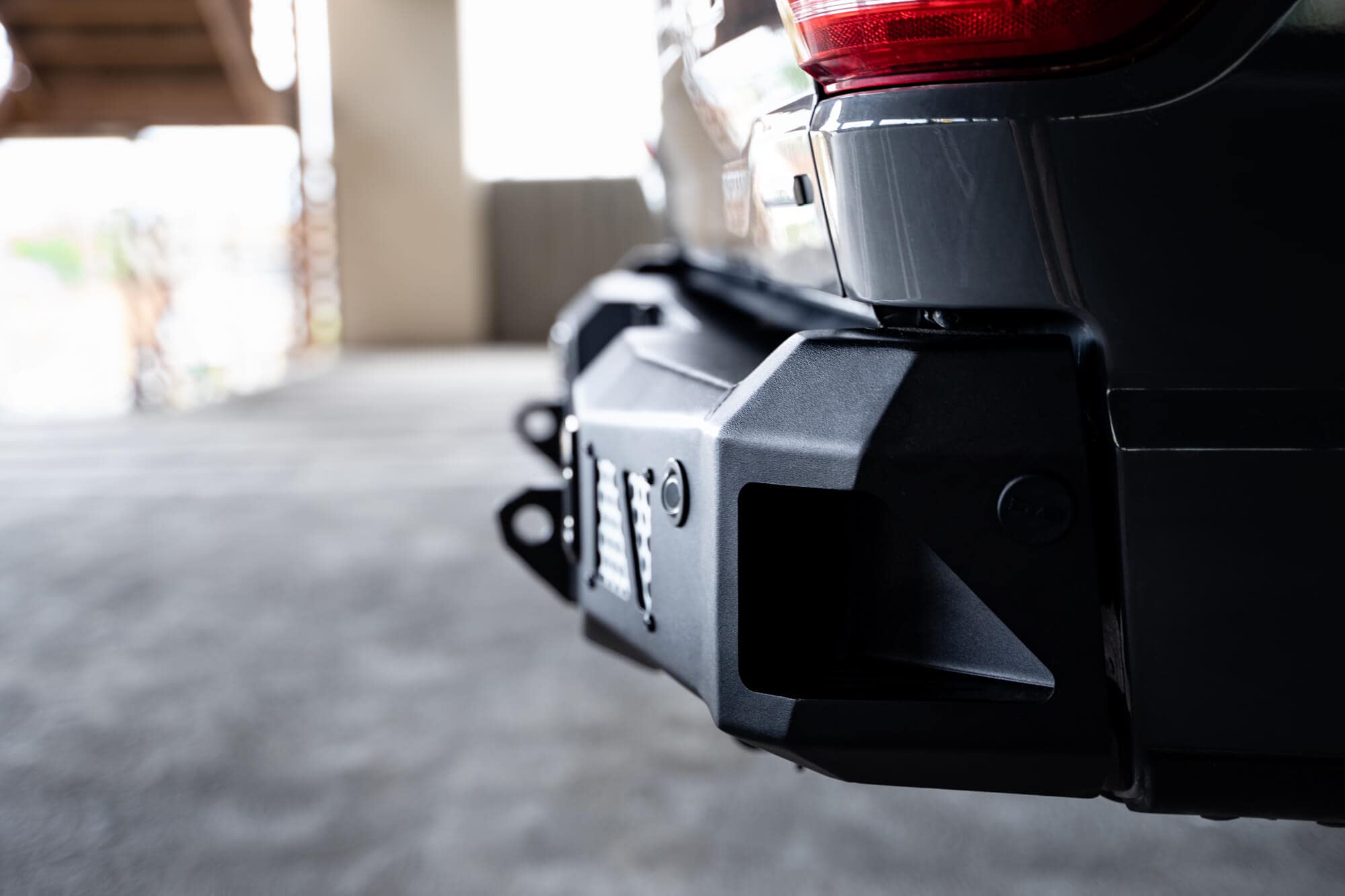 MTO Series DV8 Offroad Rear Bumper for 2021-2025 Ford F-150 | Utility Steps | Designed for Single Exhaust Setups | Accepts (2) 3" Flush Mount Pod Lights | Paintable Aluminum Inserts