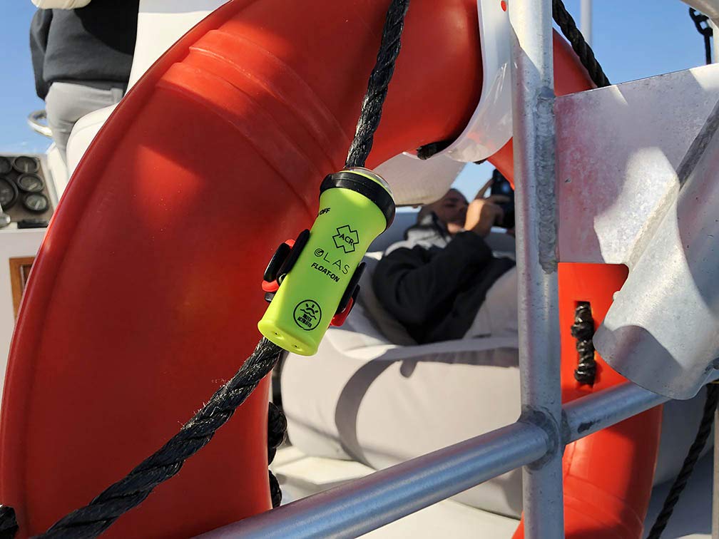 ACR FLOAT-ON OLAS Man Overboard System for adults, kids, and pets with integrated LED Flashlight and Water Activated Strobe for boating safety