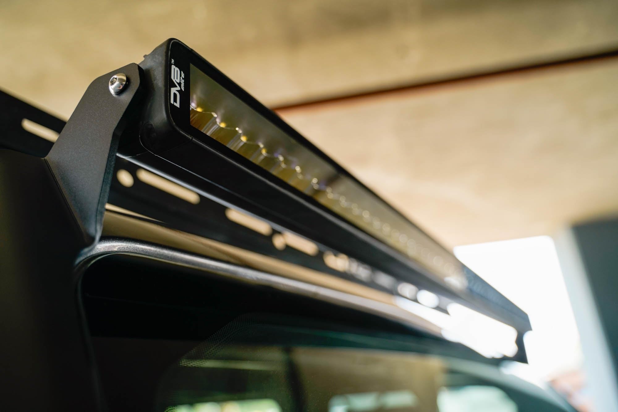 50" Light Bar Mount DV8 Offroad for 2018-2025 Jeep Wrangler JL & 2020-2025 Gladiator JT | Optional 3" Pod Light Mounts | Sleek Low-Profile Design | Black Powder Coat | Bolt-On Installation | Steel