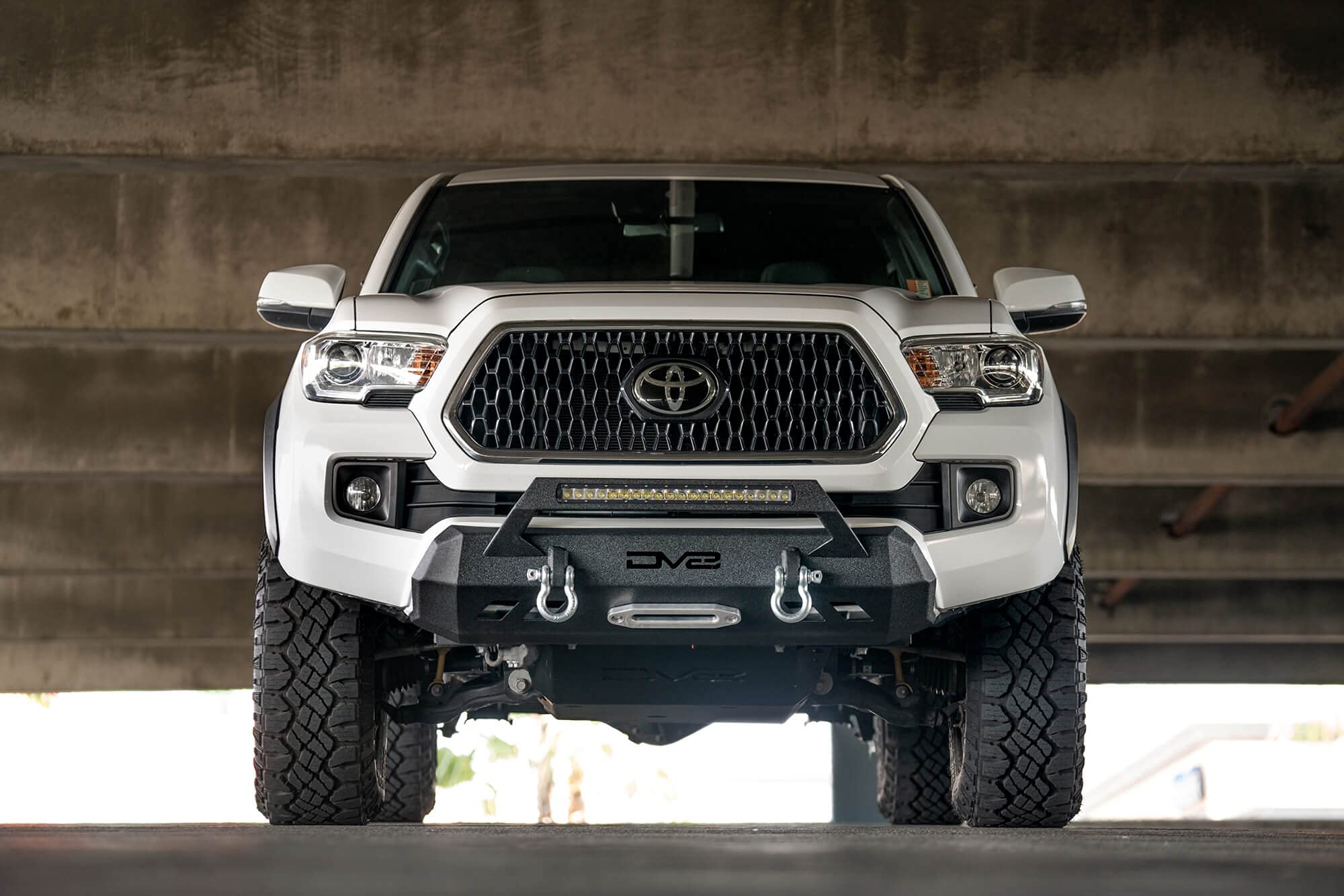 FBTT1-05 DV8 Offroad | Front Bumper fits 2016-2021 Toyota Tacoma | Center Inlay Only | Winch Mount Included | Bull Bar | Strategic Airflow Cutouts | Welded Light Tabs, Black