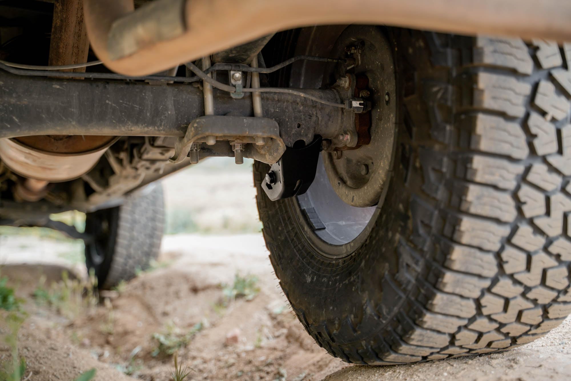 Skid Plates for Rear Shock 2016-2023 Toyota Tacoma | Protects Shocks When Off-Road | Integrated Drain Holes | Included Black M12 Hardware | 4mm Steel Construction | Sold as a Pair