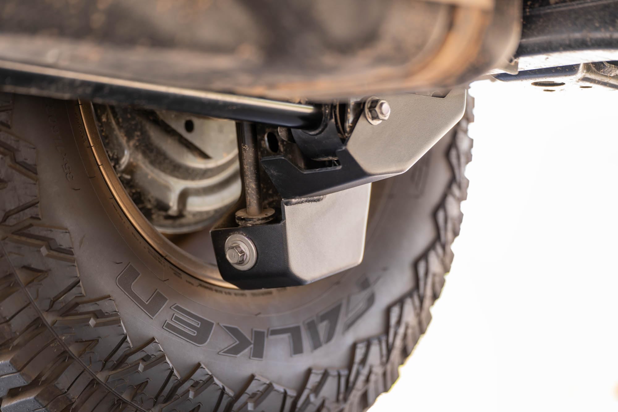 Rear Shock & Link Skid Plates DV8 for 2024 Toyota Tacoma | Protects Lower Shock Mount & Link | Built-in Drain Holes | Single Piece Design | Fully Bolt-On Installation | Black Powder Coat | 4mm Steel