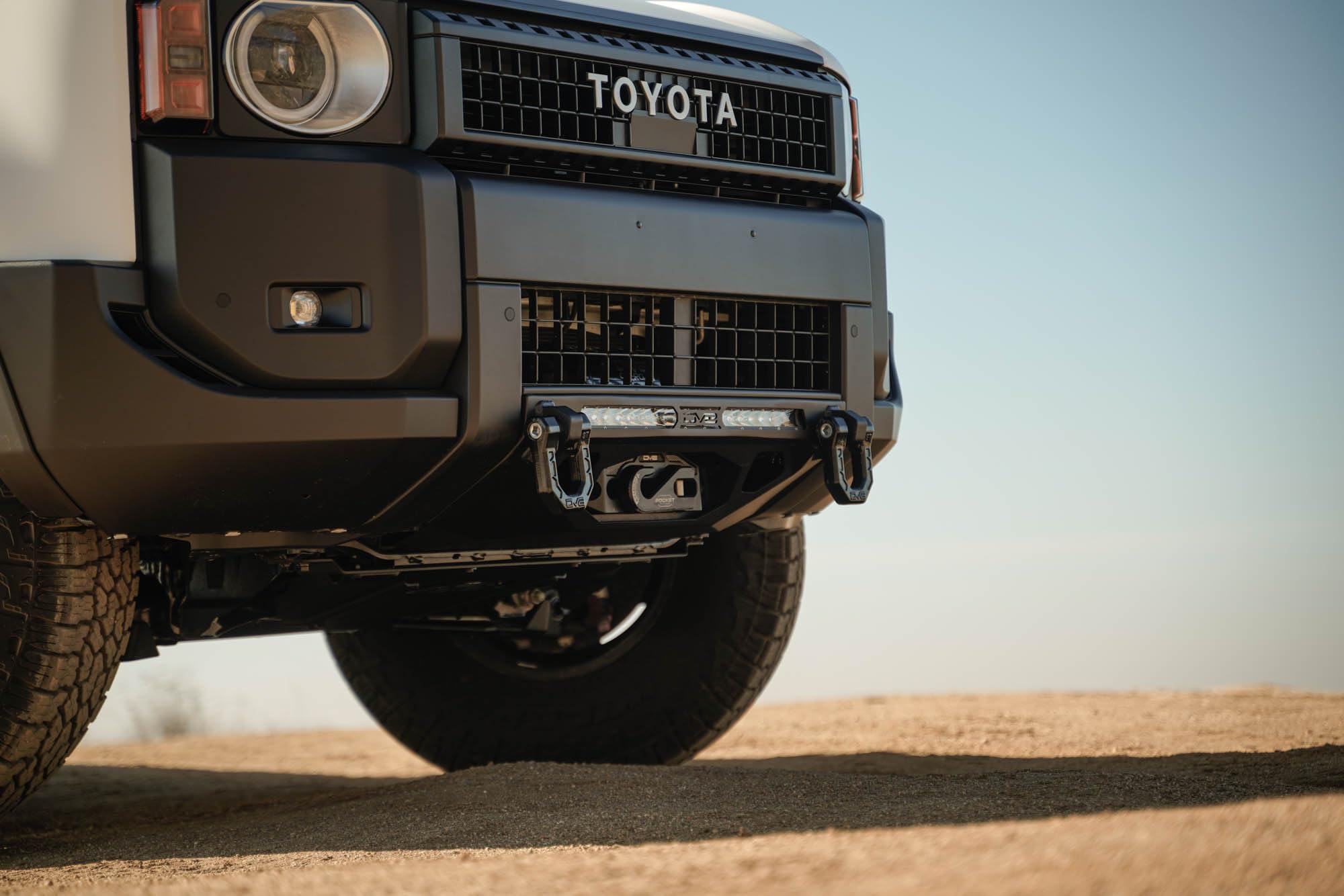 Centric DV8 Offroad Front Bumper for 2024 Toyota Land Cruiser | Center Mount Design | Heavy-Duty Winch Mount | (1) 20" Single Row Light Bar Mount | Pair of D-Ring Mounts | Powder Coated Black | Steel