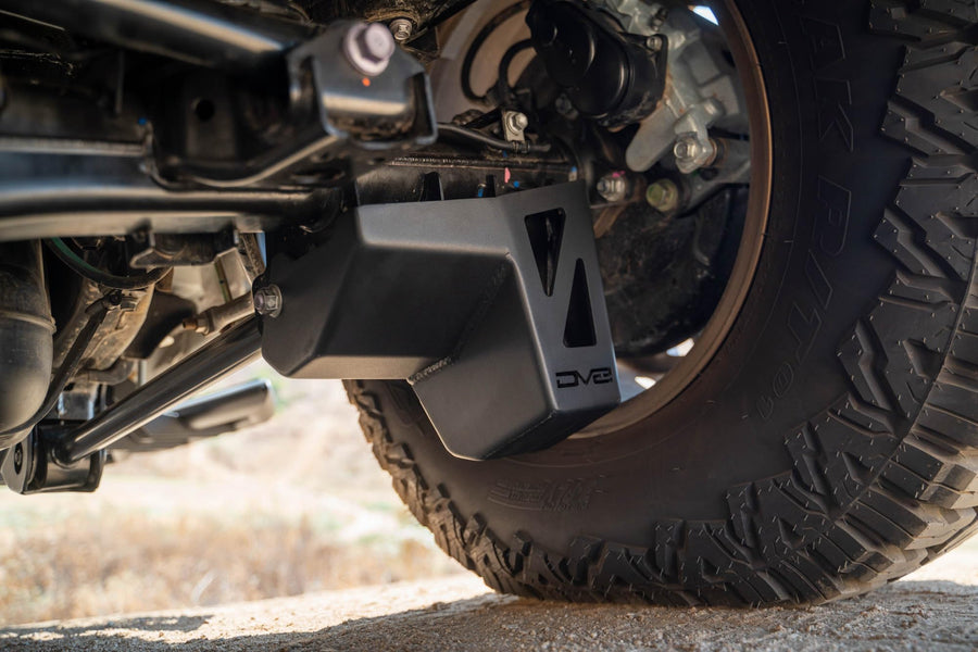 Rear Shock & Link Skid Plates DV8 for 2024 Toyota Tacoma | Protects Lower Shock Mount & Link | Built-in Drain Holes | Single Piece Design | Fully Bolt-On Installation | Black Powder Coat | 4mm Steel