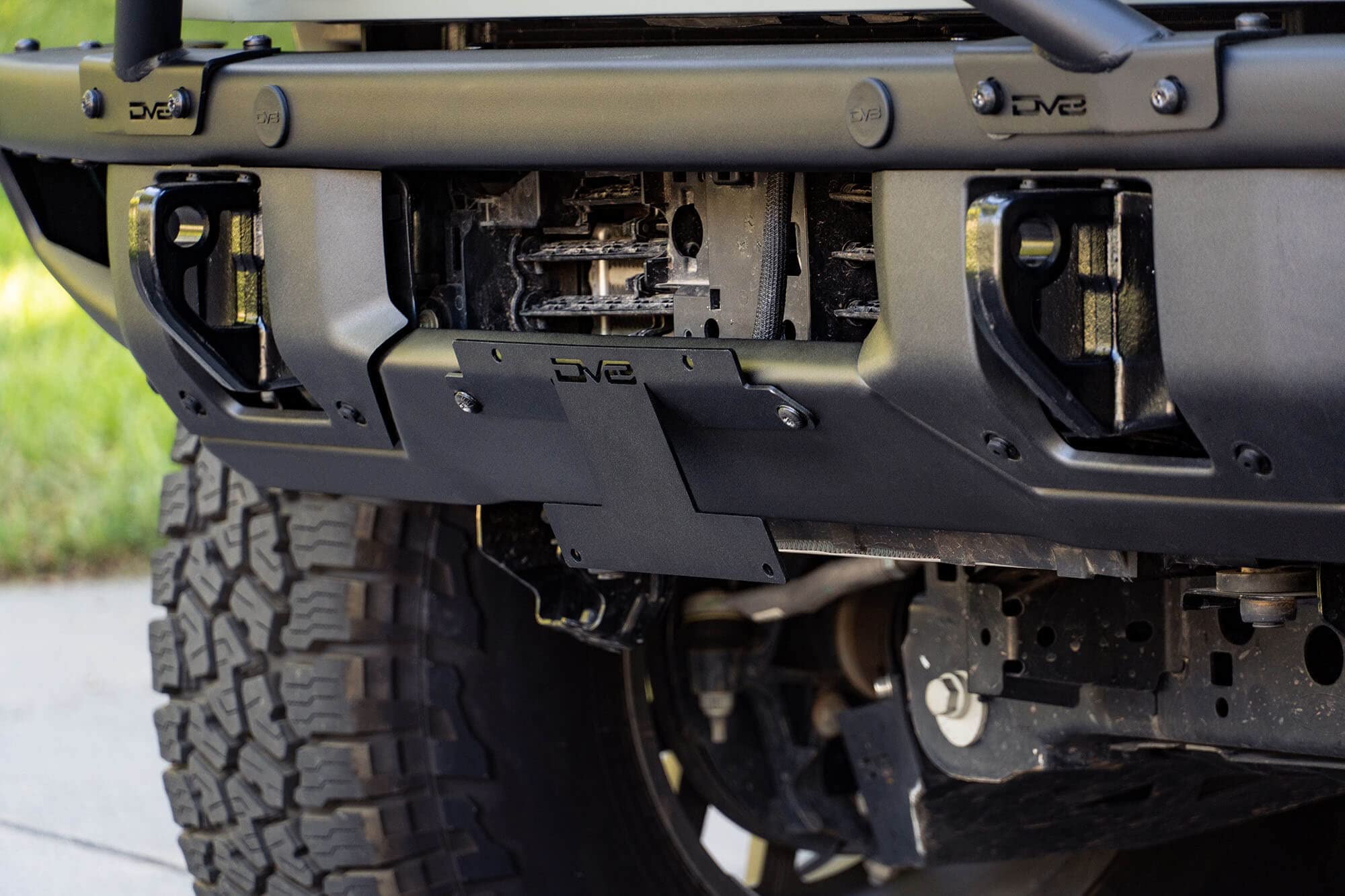 License Plate Relocation Bracket DV8 Offroad for 2021-2024 Ford Bronco | OEM Steel Front Bumper | Lower Center Mount | Keeps Grille Open | Quick & Easy Installation
