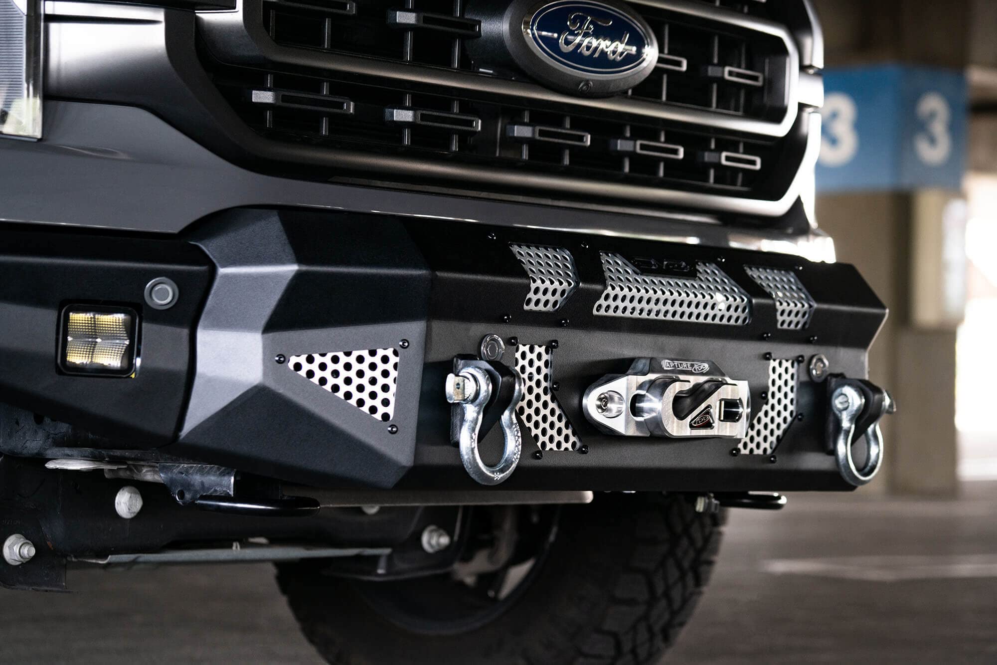 FBFF1-10 | DV8 Offroad | MTO Series Front Bumper for 2021-Current F-150 | 3 Pc Modular Construction | Factory Sensor Compliant | Integrated Winch Mount | Strategic Airflow Cutouts | LED Light Mounts