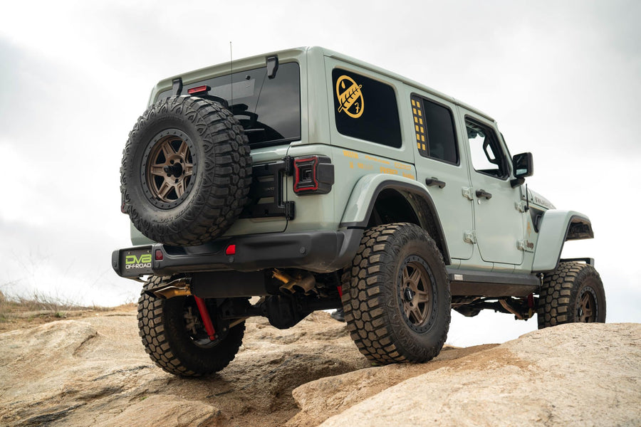 Spare Tire Carrier DV8 Offroad for Jeep Wrangler JL | Removes Weight of Spare Tire from The Tailgate Door | Cam Nut Adjustment for a Precise Fitment | Included Antenna/Whip Flag Mount | Fully Bolt-On