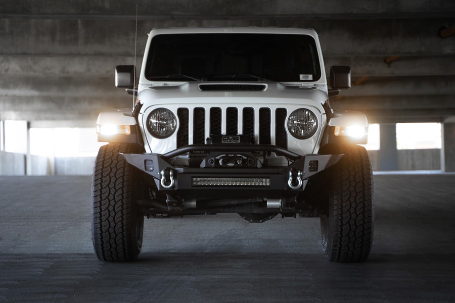 DV8 Offroad FS-7 Winch Front Bumper Mid-Width for the 2007-2025 Jeep Wrangler JK/JL & Jeep Gladiator JT | High Clearance | Bull Bar | 20” Light Bar Mount | Accepts Multiple Size Winches