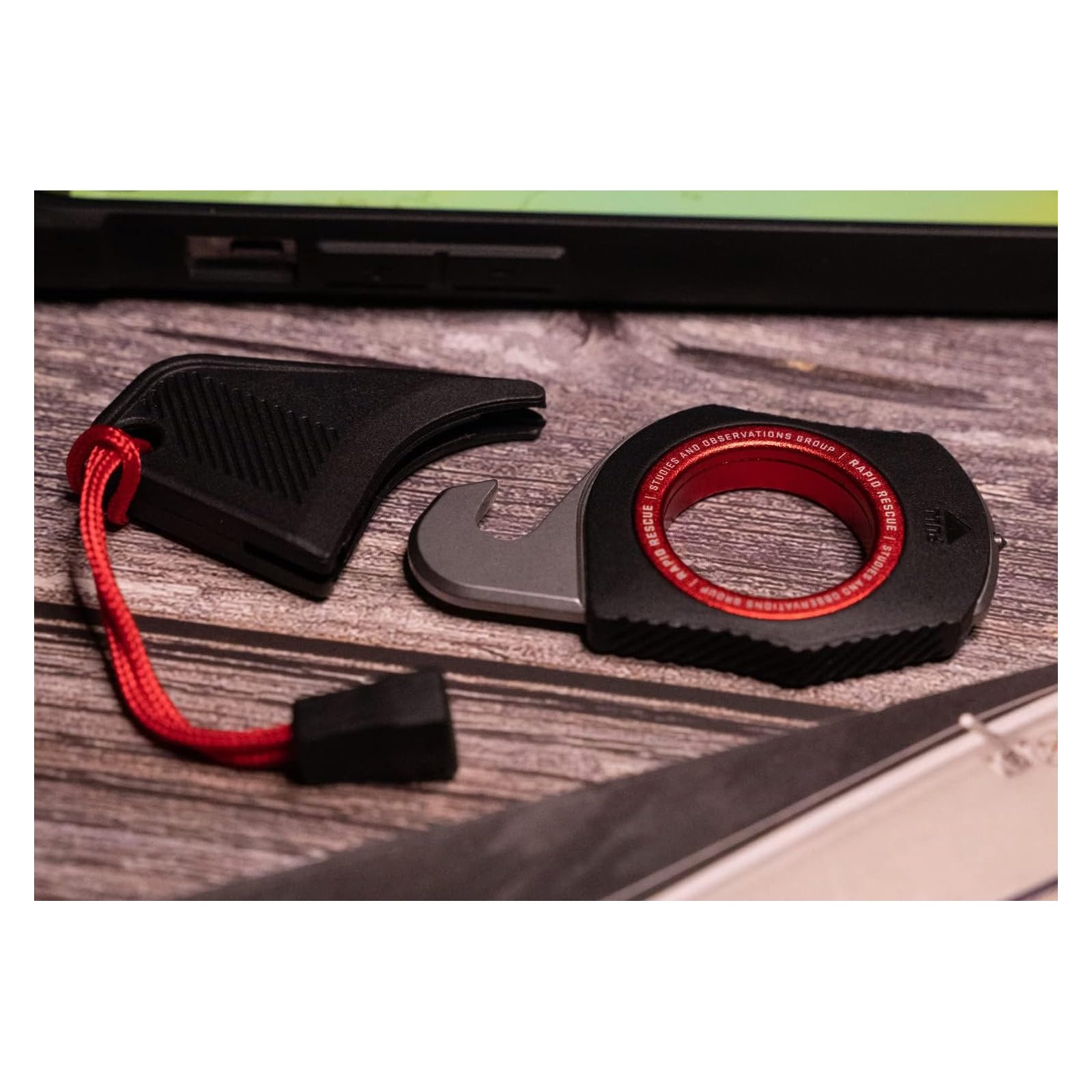 SOG Multi-Tool Rapid Rescue | Stainless Steel Seatbelt Cutter, GRN Handle, Aluminum Pull-Ring, Quick to Deploy from The Sheath, Black/Red