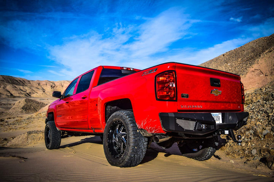 Steel Rear Bumper DV8 Offroad Compatible with Chevy Silverado 2016-18 1500 Models |High Clearance | Customizable Mesh Inserts | LED Lights Included | Reinforced Tow Points with D-Rings | RBCS1-02