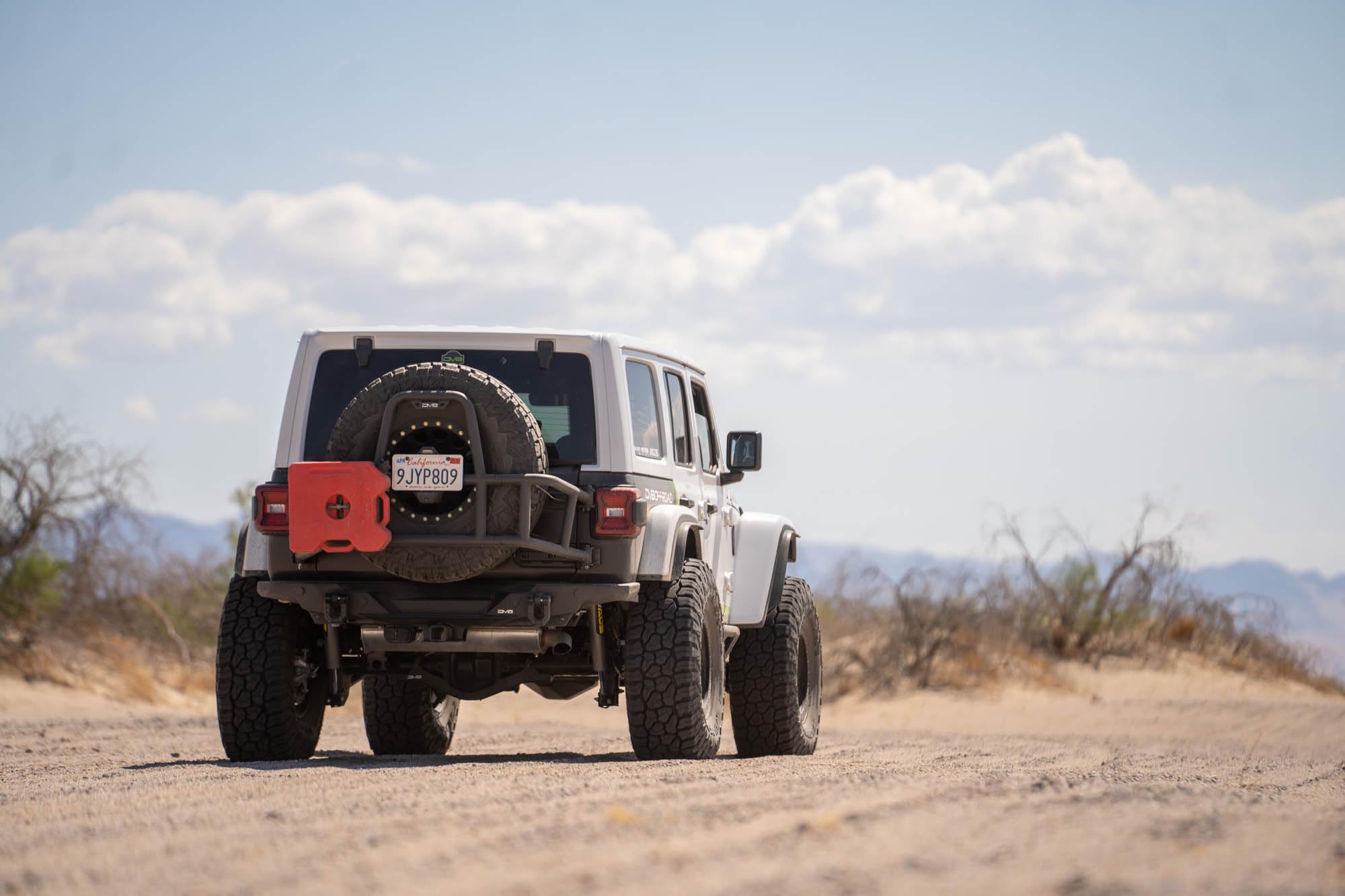DV8 Offroad Tire Carrier Body Mounted for 2018-2025 Jeep Wrangler JL | Removes Weight of Spare from Door Hinges | Fits Up to a 40 x 13.50 Tire with a -25 Max Offset | Improves Departure Angle | Steel