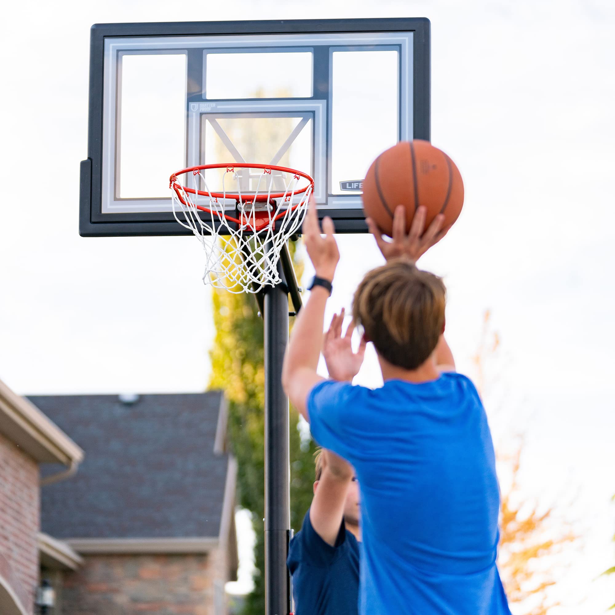 Lifetime Basketball Hoop Adjustable In-Ground, Action Grip Height Adjustment 7.5-10 Ft, 50-Inch Shatterproof Fusion Backboard, Slam-It Rim, Powder-Coated Steel Pole