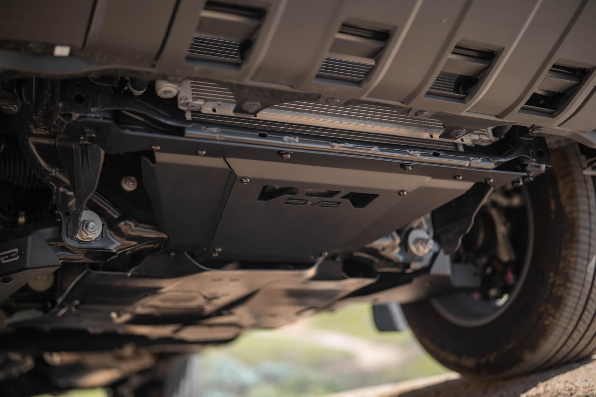 Front Skid Plate DV8 Offroad for 2024-2025 Toyota Land Cruiser | Protects Bottom of Engine & Intercooler | Installs to 4 Mounting Points for a Sturdy Design | Micro-Texture Black Powder Coat | Steel