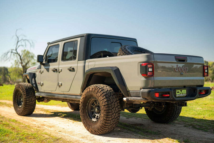 DV8 Offroad Spare Tire Carrier Adjustable in-Bed for 2020-2025 Jeep Gladiator JT | Flat or Angled Mounting Positions | Stainless Single Action Latching Mechanism | Compatible w/Most Wheel/Tire Setups