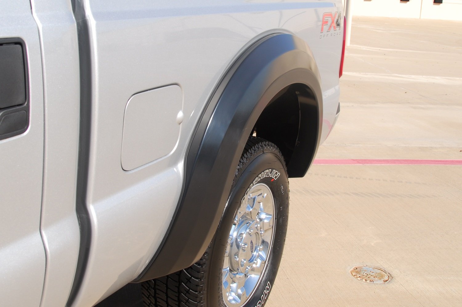 Lund Elite Series EX314T Black Extra Wide Style Textured Front and Rear Fender Flare - 4 Piece