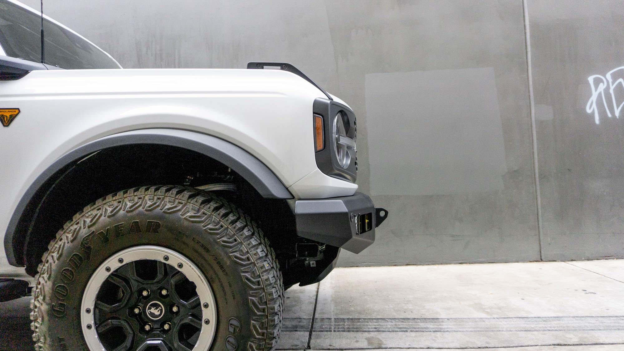 OE Plus Series V2 DV8 Offroad Front Bumper for 2021-2025 Ford Bronco | Low-Profile OE Style Design | Mounts One 20" Light Bar | Mounts Four 3" Pod Lights | Retains Adaptive Cruise Control