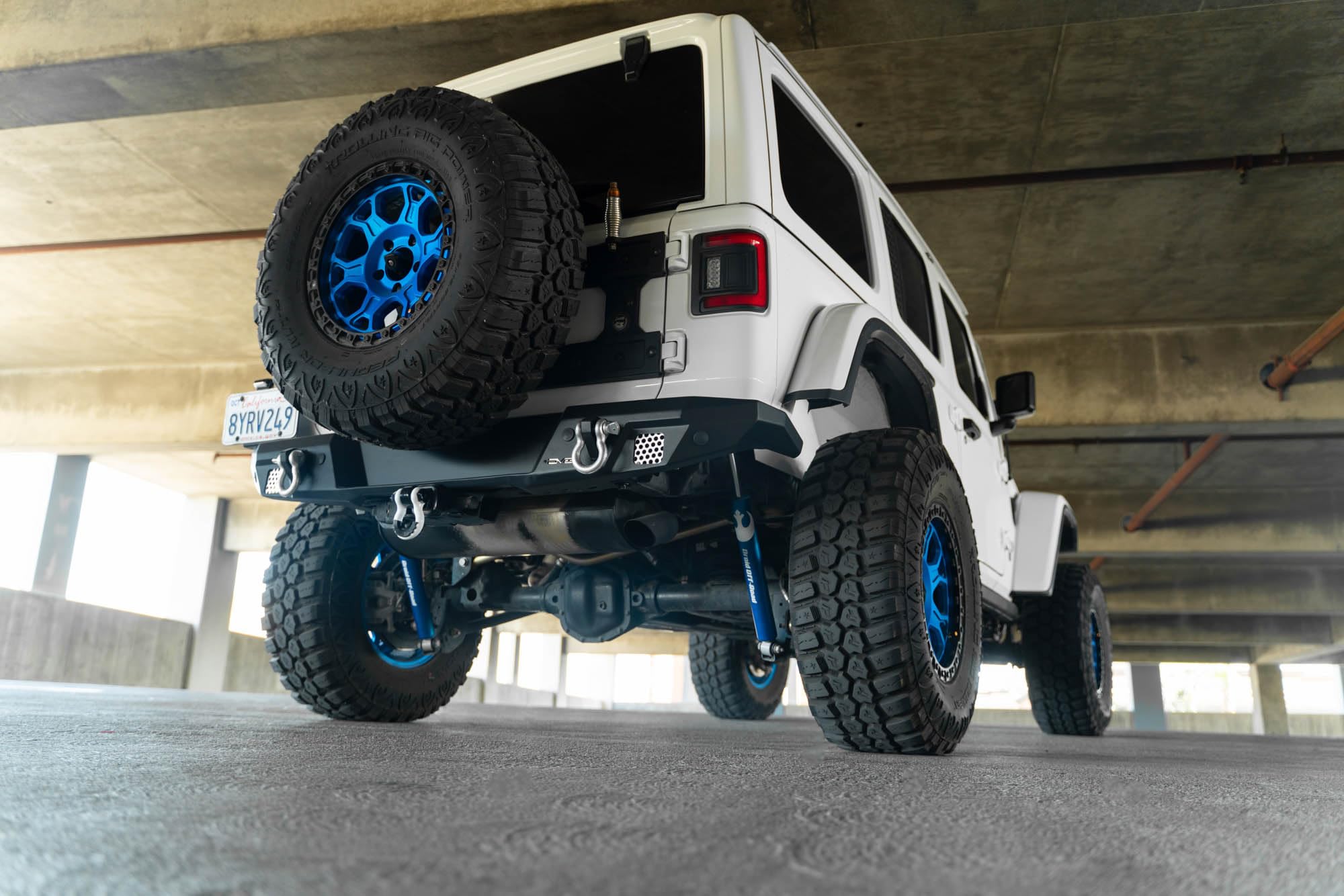FS-7 Series DV8 Offroad Rear Bumper for the 2018-2025 Jeep Wrangler JL | Sleek Mid-Width Design | Compatible with Factory Hitch | Fits up to 37” Spare Tire Above Bumper Using Factory Carrier