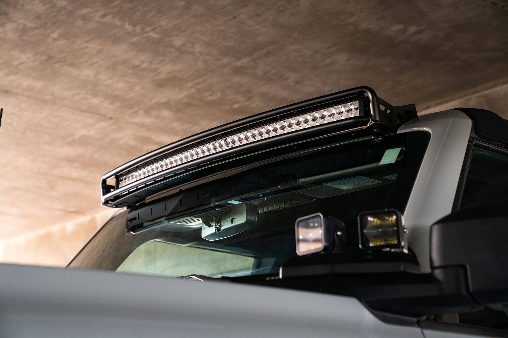 40" Curved LED Light Bar Mount DV8 Offroad for 2021-2025 Ford Bronco | Fits (1) 40" Curved LED bar or up to (12) 3" pods | Mounts to OEM Accessory Location | No Drill Installation