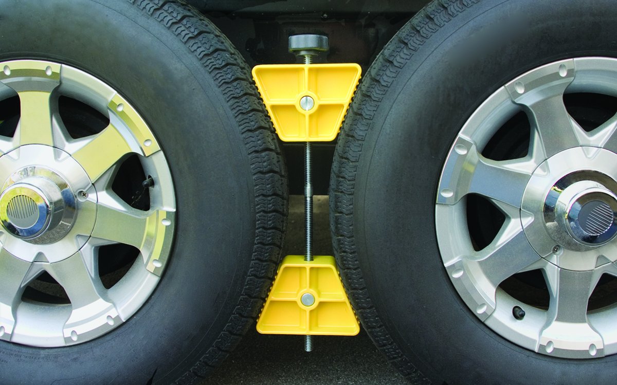 Camco RV Small Wheel Stop - Features a Lightweight Heavy-Duty Design with a Rubber Handle, Prevents Shifting of Trailer Tandem Tires While Parked or Re-Hitching, and Fits 26” to 30” Tires (44652)