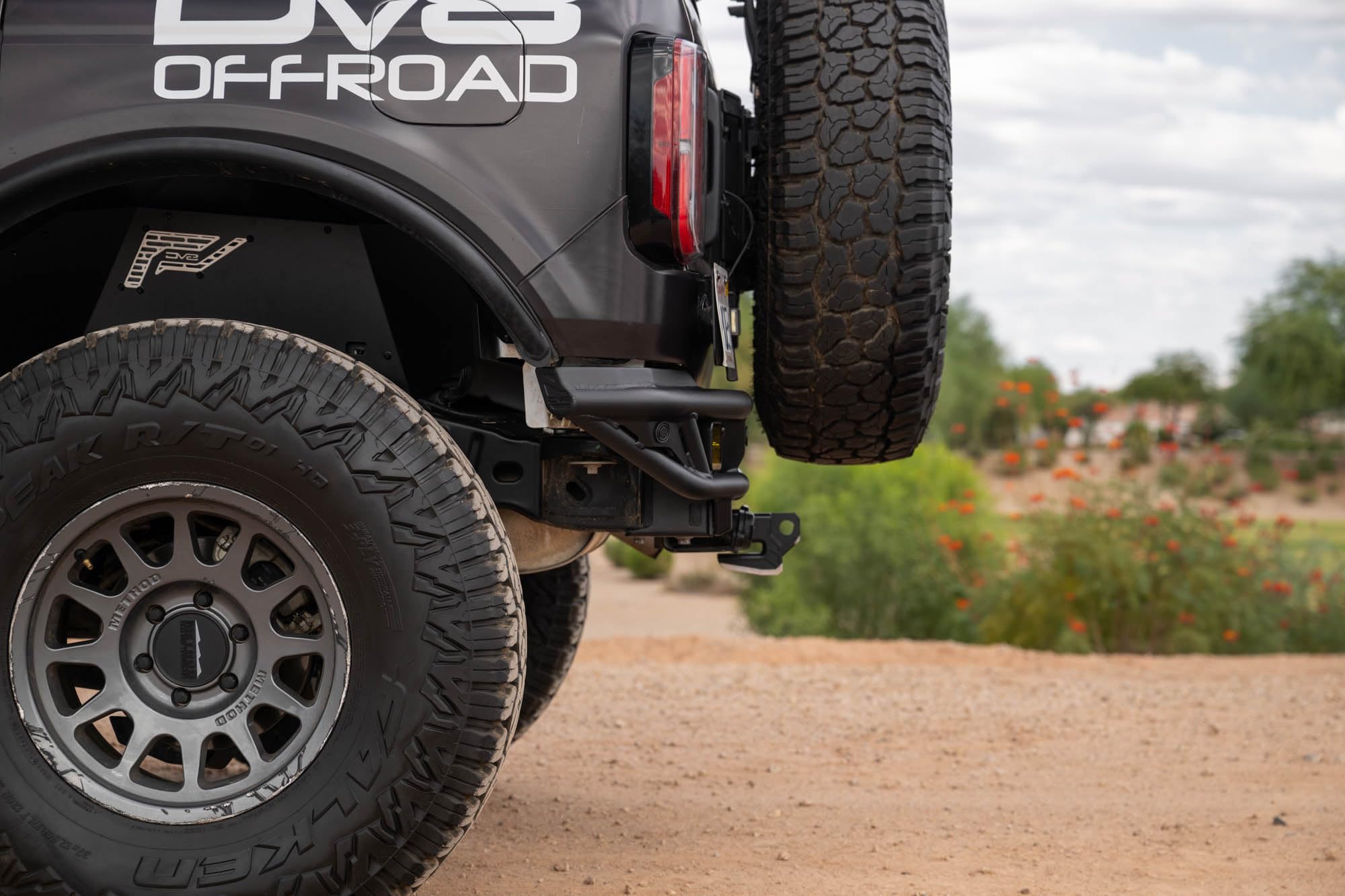 Rear Tube Bumper DV8 Offroad for 2021-2025 Ford Bronco | Sleek Prerunner Type Design | (2) 3" Pod Light Mounts | Durable Steel Construction | Micro-Texture Powder Coated Finish | Fully Bolt-On Design