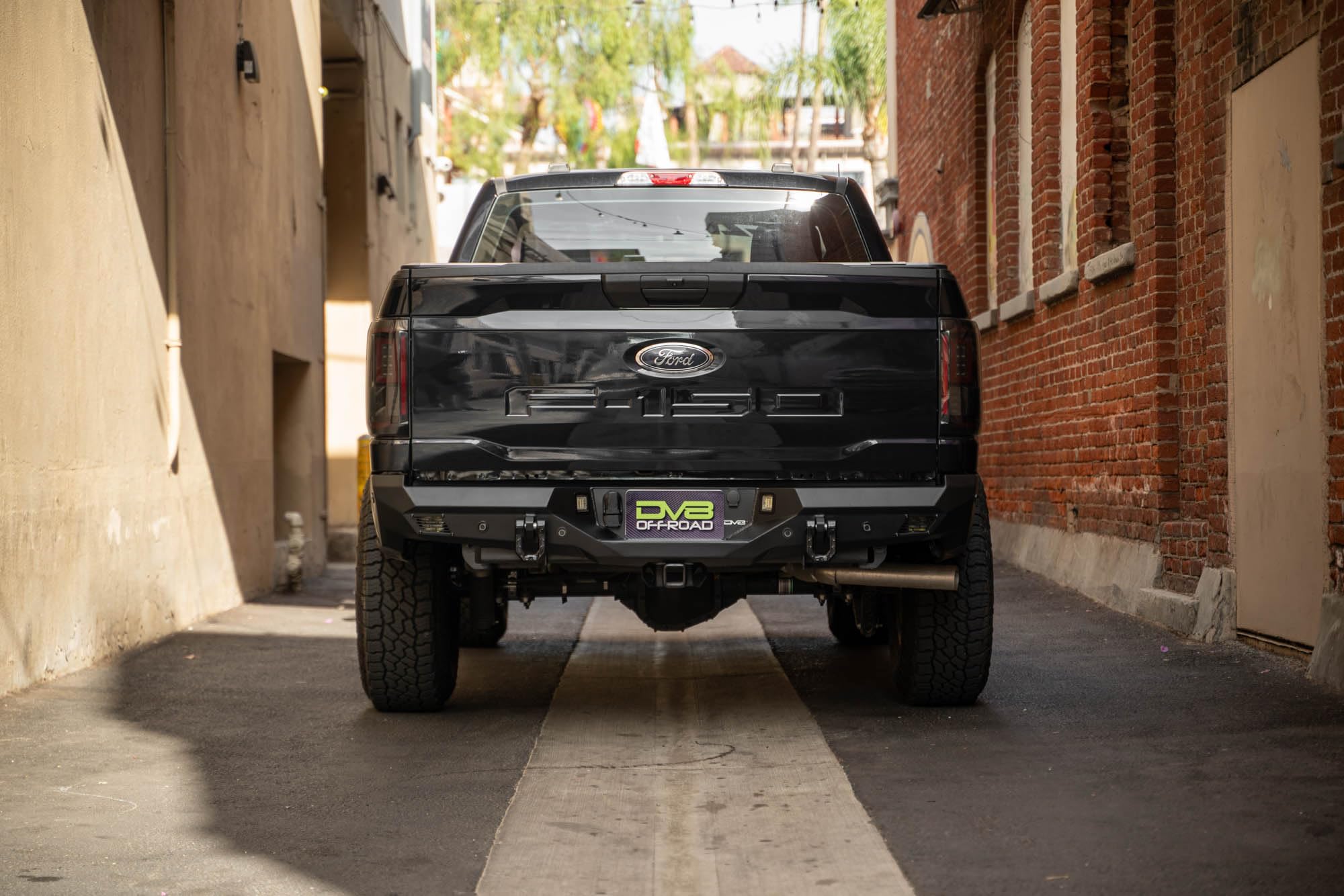 Rear Bumper DV8 Offroad Spec Series for 2021-2025 Ford F-150 | Full-Width Design | (2) 3" Pod Light Mounts | Pair of 1" D-Ring Mounts | Micro-Texture Black Powder Coat Finish | Steel Construction