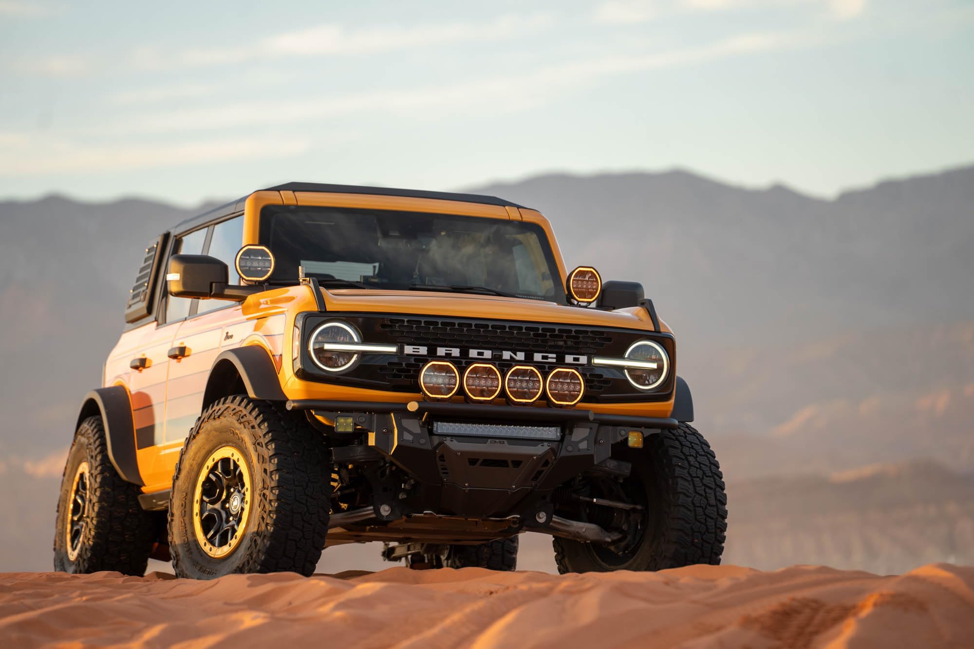 Front Bumper DV8 Offroad Tube Series for 2021-2025 Ford Bronco | Ultra High-Clearance Design | Center Light Mount | Prerunner Style Bolt-On Light Hoop | Recovery Points | Front Skid Plate | Steel