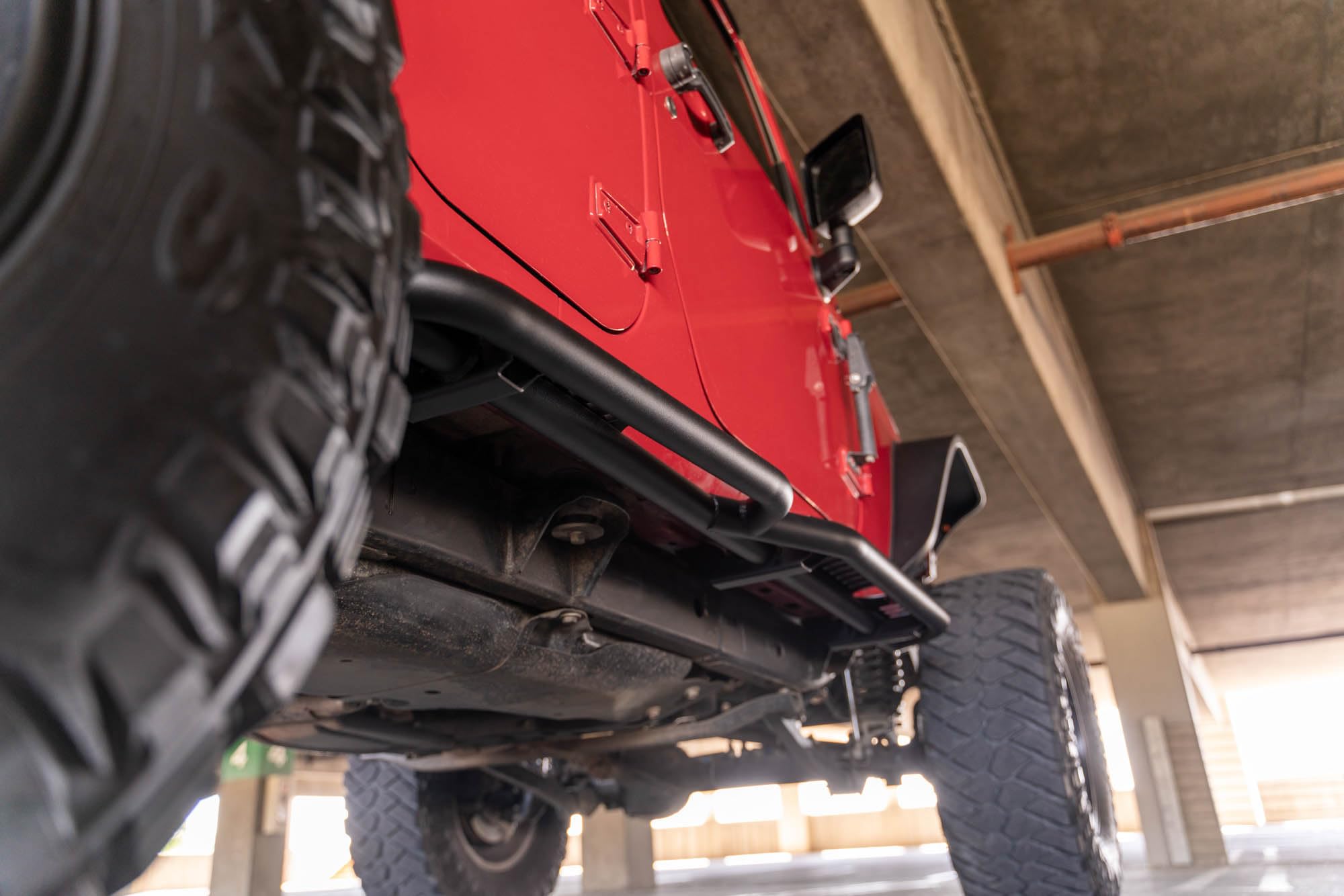 OE Plus DV8 Offroad Side Steps for The 2007-2018 Jeep Wrangler JK 4-Door | Body/Pinch Weld Mounted Side Steps | Protection Against Light Debris (Not Intended for Sliding)
