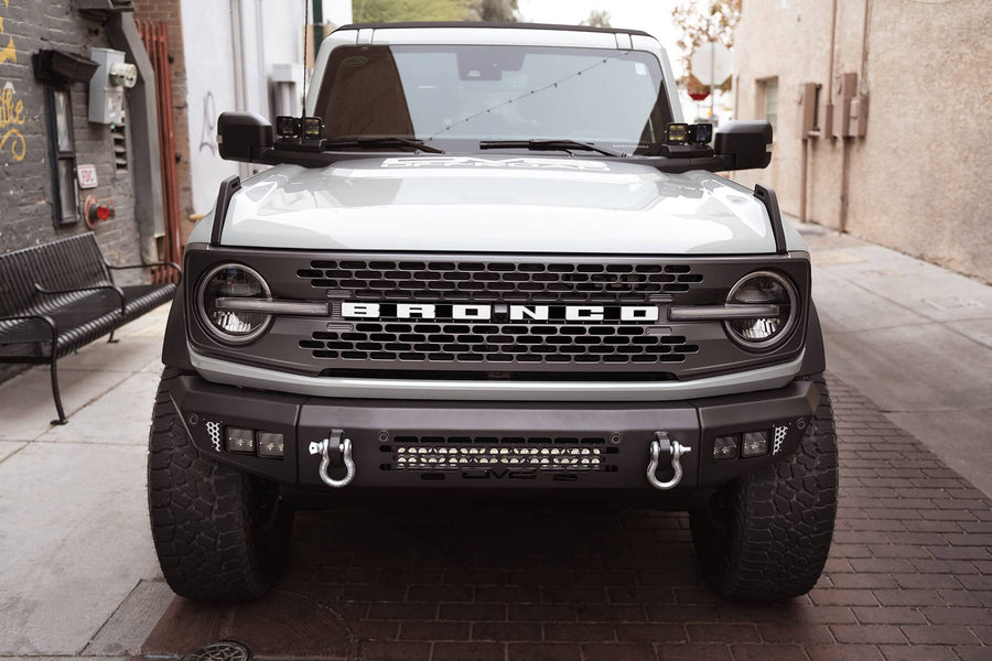 OE Plus Series DV8 Offroad Front Bumper Compatible with 2021-2025 Ford Bronco | Multiple Light Mounts | Compatible with OEM Skid Plate, 360° Camera, & Sensors | Reinforced D-Ring Mounts