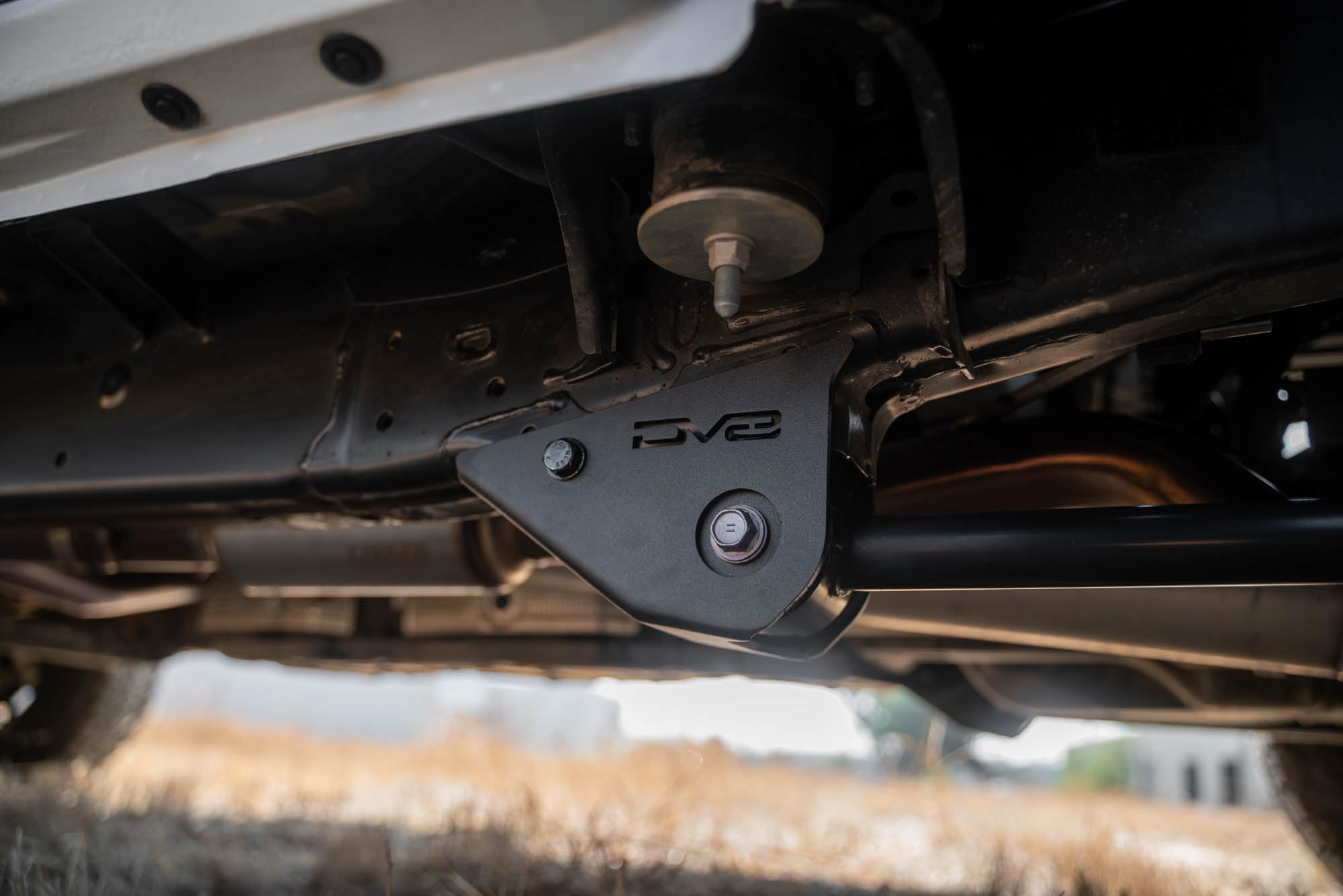 DV8 Offroad Skid Plates for Trailing Arm 2024 Toyota Tacoma | Protects the Vulnerable Trailing Arm Mounts | Helps Prevent Your Truck from Catching on Obstacles | 5mm Steel | Fully Bolt-On Installation