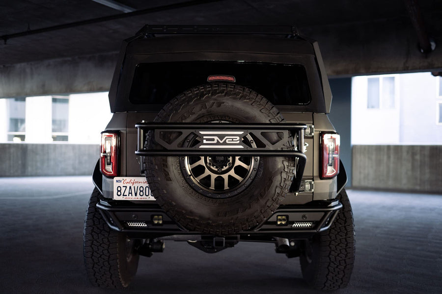 Spare Tire Guard & Accessory Mount DV8 Offroad for 2021+ Ford Bronco | Accepts Up to (Most) 37" Tires | Can Accept Locking Pins | Quick and Easy Install | Paintable Aluminum Panels