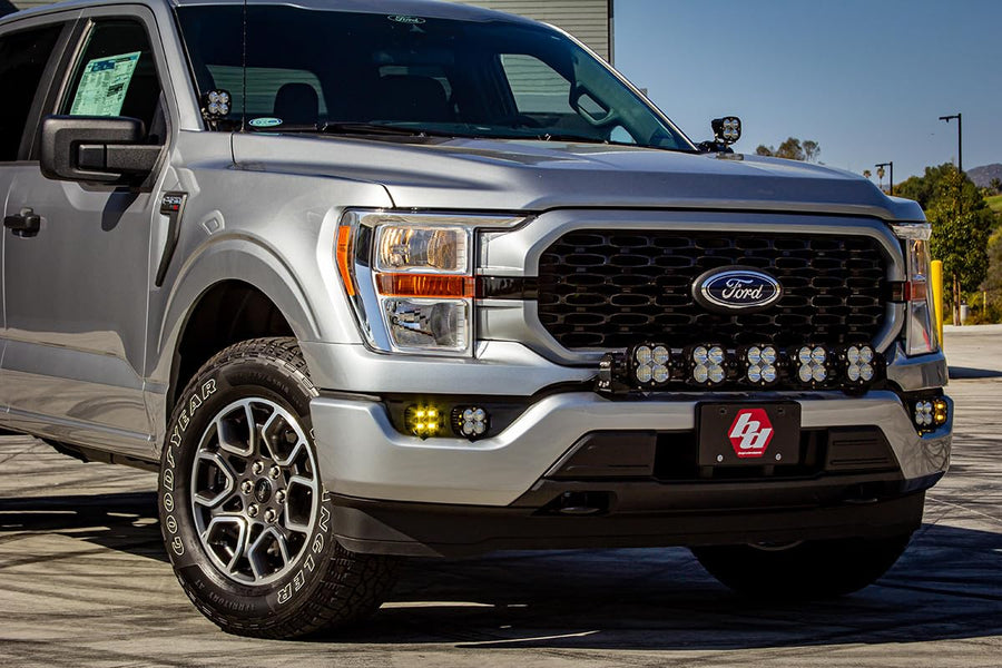 Baja Designs Fog Pocket Squadron SAE Sport LED Light Kit fits Ford F-150 2021+ with Upfitter Wiring Harness (Multi-Pattern; Amber)