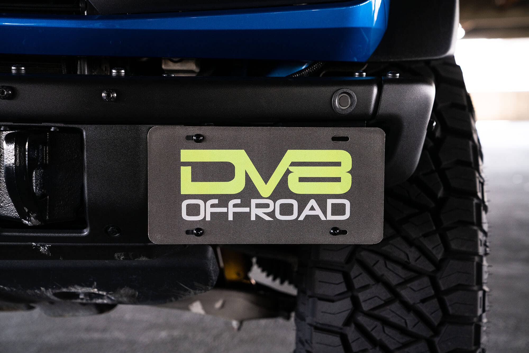 License Plate Relocation Bracket DV8 Offroad for 2021-2024 Ford Bronco | Compatible with The Factory Steel Modular Front Bumper | Side Mounted | Does Not Block Grille