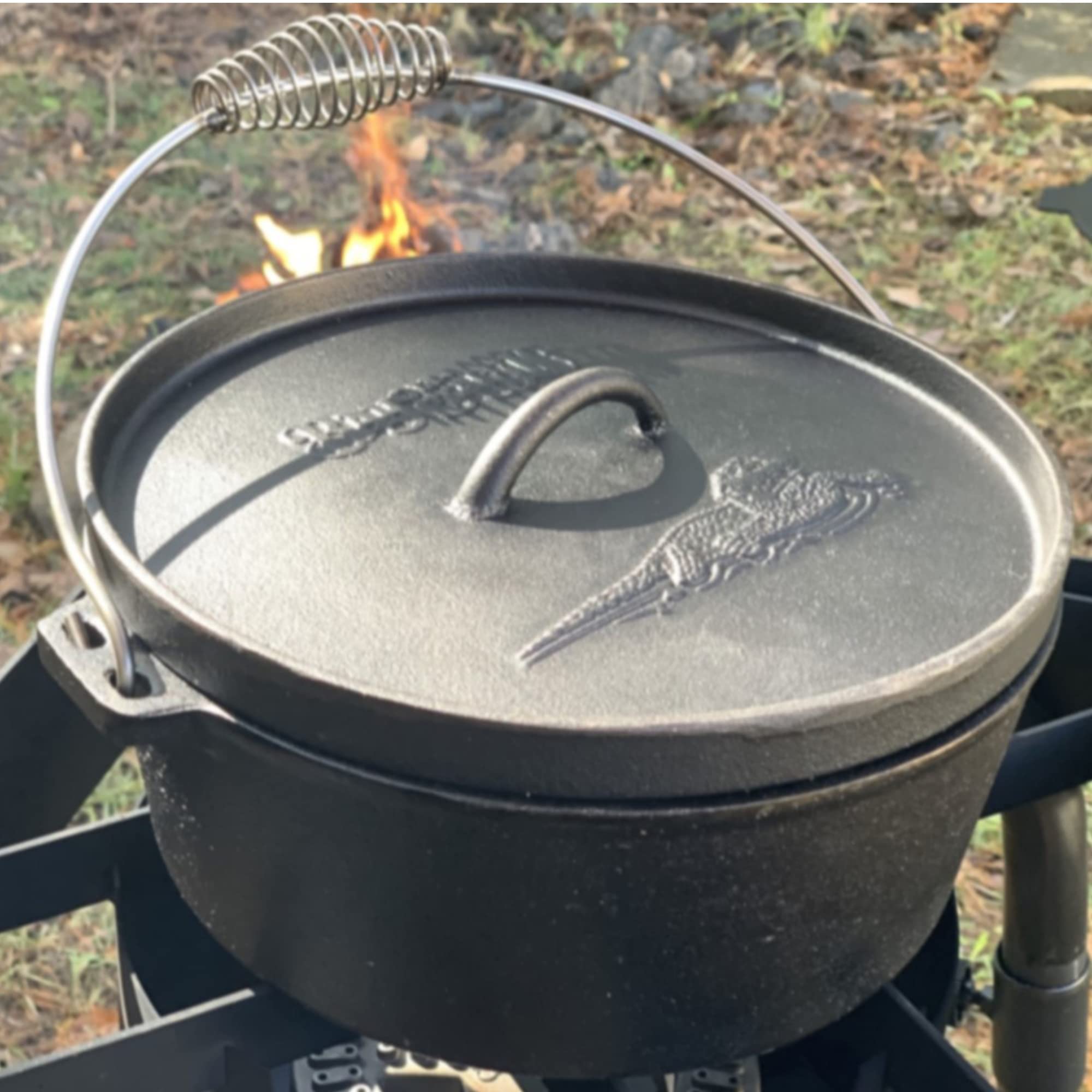 Bayou Classic 2-qt Cast Iron Dutch Oven Features Flanged Camp Lid Stainless Coil Wire Handle Grip Perfect To Use Over A Campfire To Prepare One-Pot Meals Bake Cornbread Biscuits or Cobbler