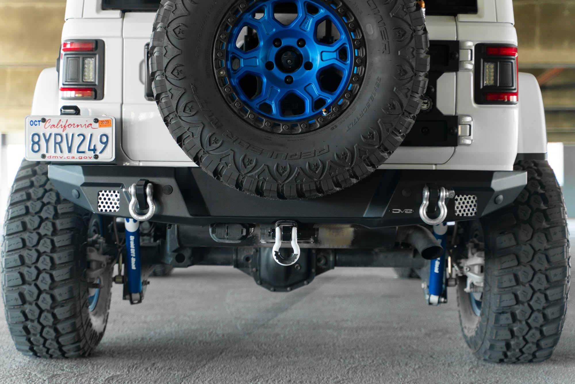 FS-7 Series DV8 Offroad Rear Bumper for the 2018-2025 Jeep Wrangler JL | Sleek Mid-Width Design | Compatible with Factory Hitch | Fits up to 37” Spare Tire Above Bumper Using Factory Carrier