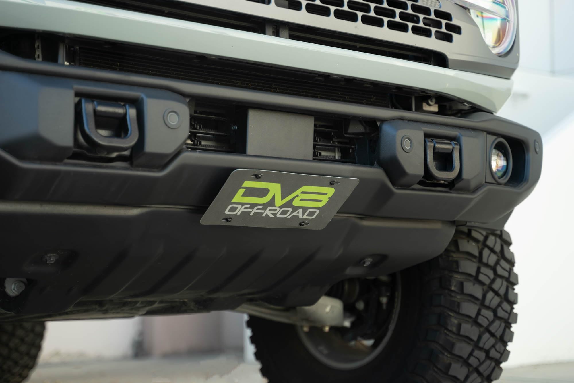 Slanted Front License Plate Mount Capable for The 2021-2024 Ford Bronco | Fits The Factory Capable Steel Front Bumper ONLY | Relocates License Plate Below The Grille | DV8 Offroad