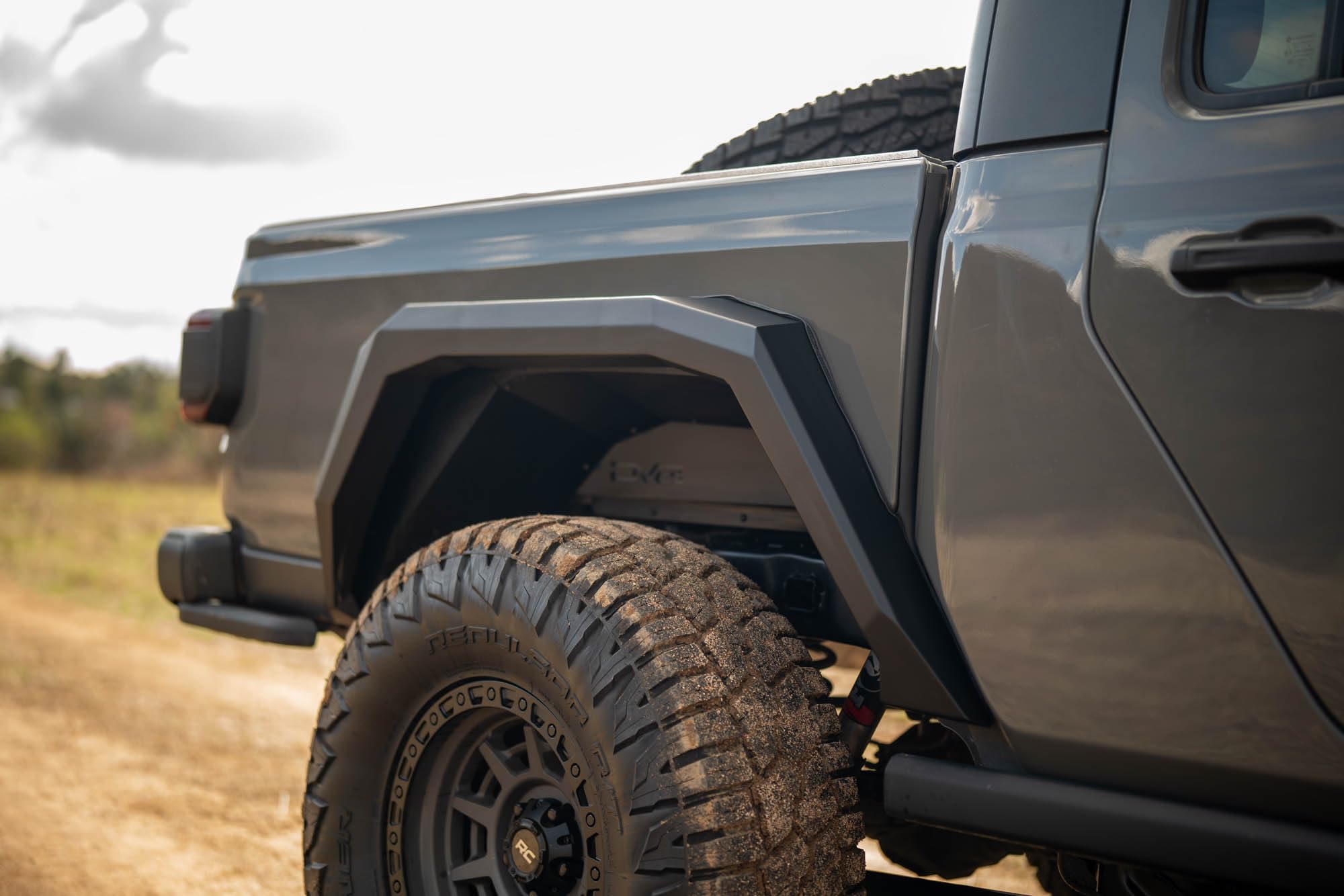 Armor Fender Flares DV8 Offroad for 2020-2025 Jeep Gladiator JT | Rigid Armor-Plated Steel Design | Narrow Width | Paintable Aluminum Accent Panels | (2) Amber Turn Signals | Powder Coated Black