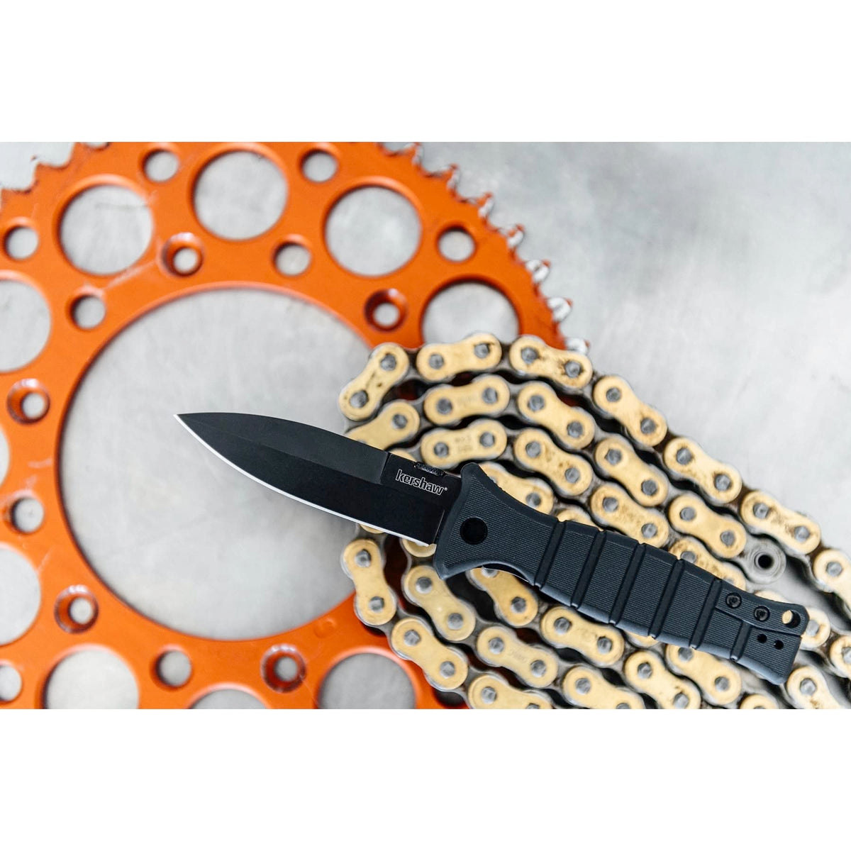 Kershaw Pocketknife XCOM Military-Style; 3.6-inch Black-Oxide Coated Blade and 8Cr13MoV Steel, Spearpoint Blade, Sharpened One Side, and Glass Filled Nylon Handle, Manual Open, Reversible Pocketclip