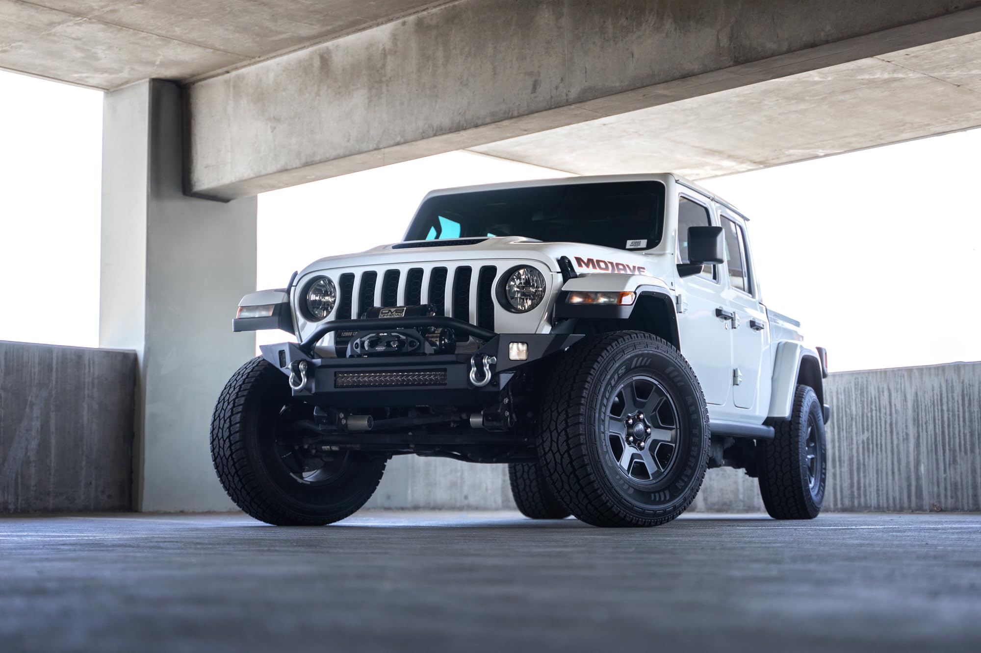 DV8 Offroad FS-7 Winch Front Bumper Mid-Width for the 2007-2025 Jeep Wrangler JK/JL & Jeep Gladiator JT | High Clearance | Bull Bar | 20” Light Bar Mount | Accepts Multiple Size Winches