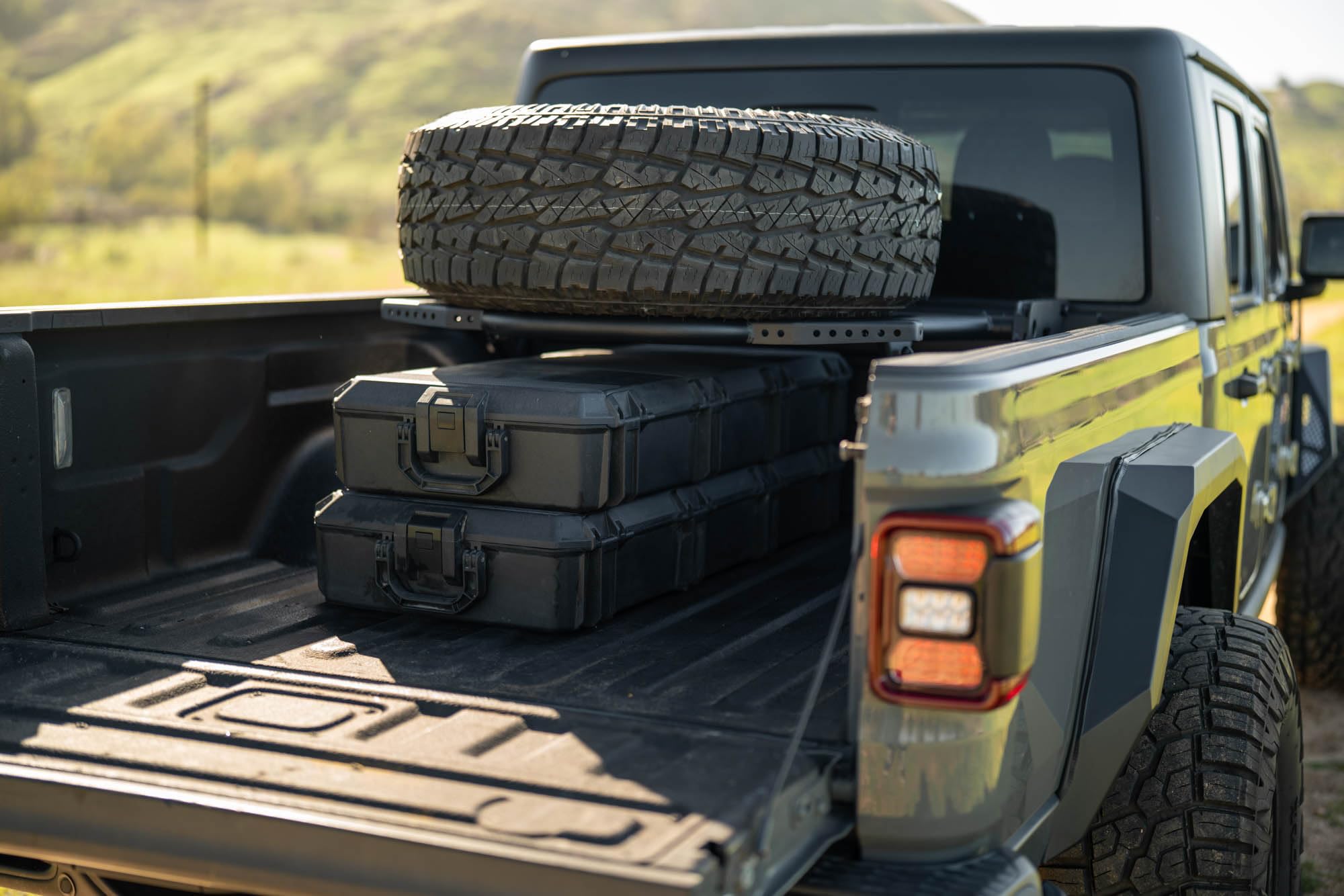 DV8 Offroad Spare Tire Carrier Adjustable in-Bed for 2020-2025 Jeep Gladiator JT | Flat or Angled Mounting Positions | Stainless Single Action Latching Mechanism | Compatible w/Most Wheel/Tire Setups