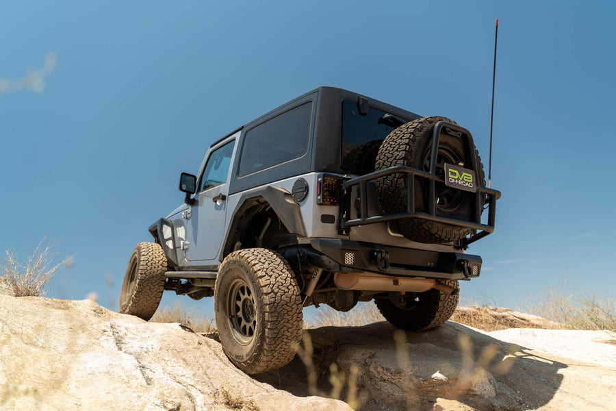 Tire Carrier Body Mounted for 2007-2018 Jeep Wrangler JK | Improves Departure Angle | Transfers Weight from The Door Hinges to The Vehicle Body | LED License Plate Light | 2 Whip Flag/Antenna Mounts