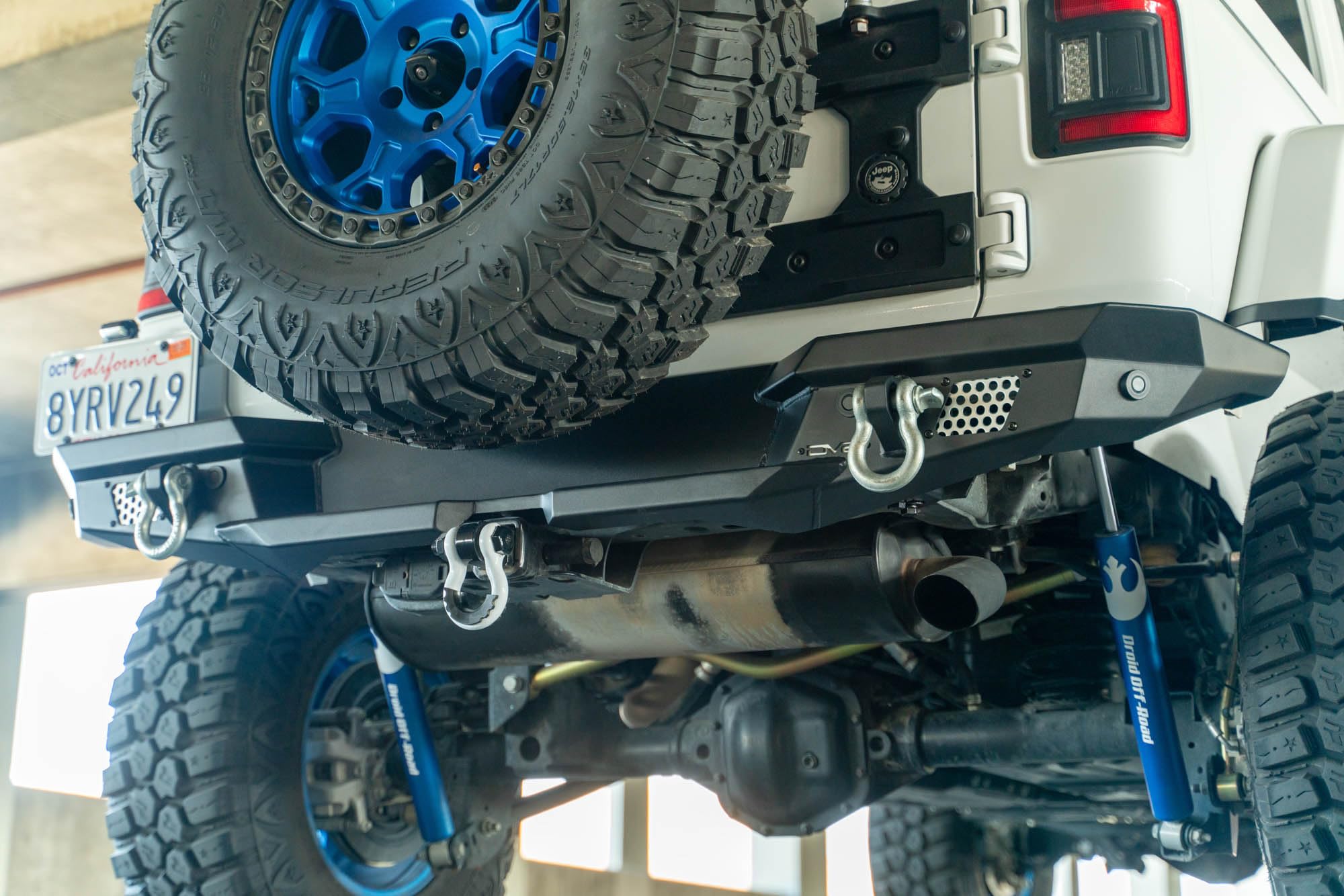 MTO Series DV8 Offroad Rear Bumper for 2018-2025 Jeep Wrangler JL | Full Width Matching Factory & Aftermarket Fenders | Compatible w/Factory Hitch & Harness | OEM Mount Can Fit up to a 37” Spare Tire
